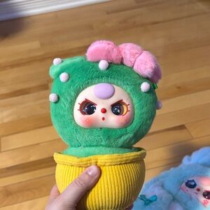 Green and Yellow Plush Toy with Pink Accents
